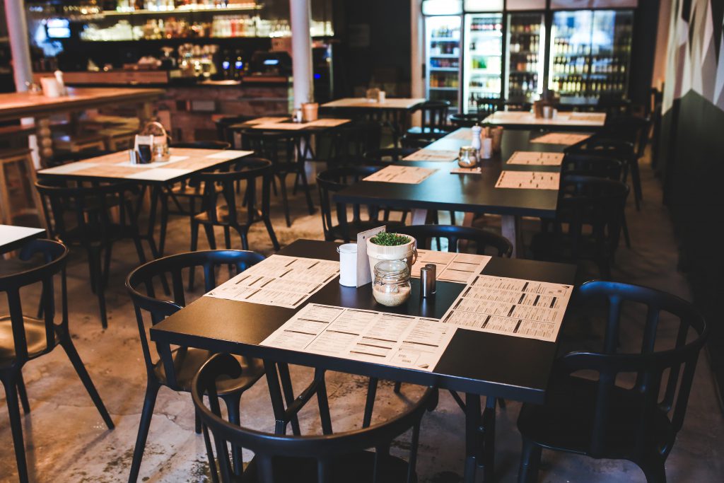 Tables and chairs set up in a restaurant