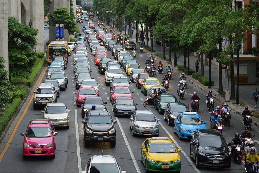 Vehicles lined up one after another on a city street