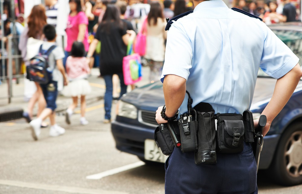 Police officer watching crowds